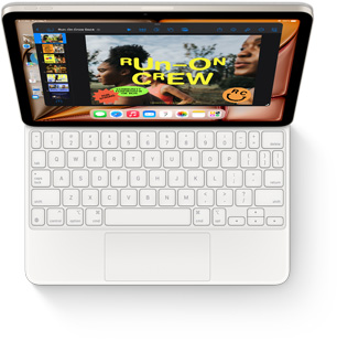 iPad Air sedd ovanifr?n med ett vitt Magic Keyboard.